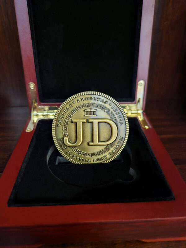 Doctorum's JD Coin is truly remarkable tribute and an exceptional gift for the JD in your life. Whether celebrating a new law school graduate or honoring a seasoned legal eagle, this unique creation is sure to make a lasting impression.